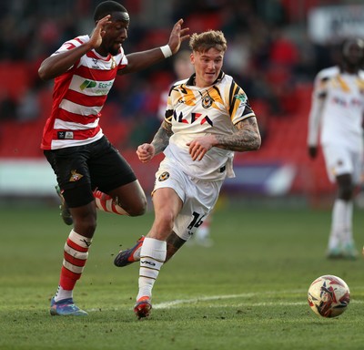 010325 - Doncaster Rovers v Newport County - Sky Bet League 2 - Kai Whitmore of Newport and Joseph Olowu of Doncaster Rovers