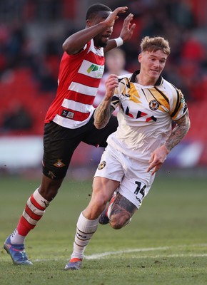 010325 - Doncaster Rovers v Newport County - Sky Bet League 2 - Kai Whitmore of Newport and Joseph Olowu of Doncaster Rovers