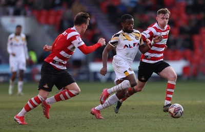 010325 - Doncaster Rovers v Newport County - Sky Bet League 2 - David Ajiboye of Newport and George Broadbent of Doncaster Rovers and James Maxwell of Doncaster Rovers