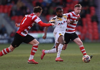 010325 - Doncaster Rovers v Newport County - Sky Bet League 2 - David Ajiboye of Newport and George Broadbent of Doncaster Rovers and James Maxwell of Doncaster Rovers