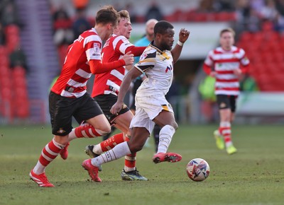 010325 - Doncaster Rovers v Newport County - Sky Bet League 2 - David Ajiboye of Newport and George Broadbent of Doncaster Rovers and James Maxwell of Doncaster Rovers