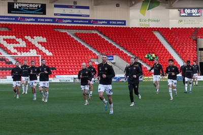 130124 - Doncaster Rovers v Newport County - Sky Bet League 2 - Newport leave the field following warm up