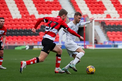 130124 - Doncaster Rovers v Newport County - Sky Bet League 2 - Scott Bennett runs at the Doncaster defence