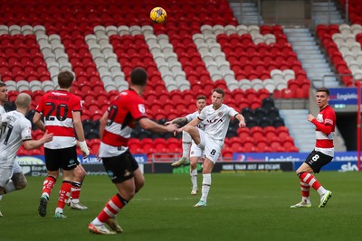 130124 - Doncaster Rovers v Newport County - Sky Bet League 2 - Bryn Morris clears