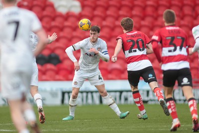 130124 - Doncaster Rovers v Newport County - Sky Bet League 2 - Ryan Delaney of Newport heads clear 