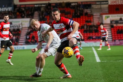 130124 - Doncaster Rovers v Newport County - Sky Bet League 2 - Will Evans of Newport fights for the ball