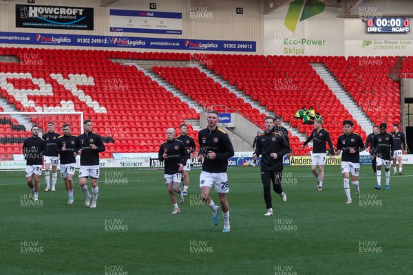 130124 - Doncaster Rovers v Newport County - Sky Bet League 2 - Newport leave the field following warm up