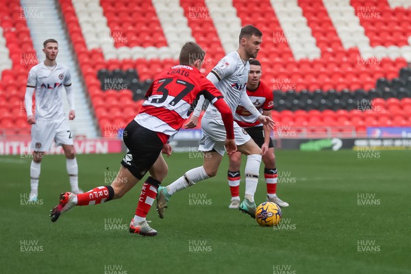 130124 - Doncaster Rovers v Newport County - Sky Bet League 2 - Scott Bennett takes on the Doncaster defence 