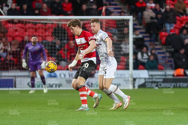 130124 - Doncaster Rovers v Newport County - Sky Bet League 2 - James Clarke is prevented from reaching the ball 