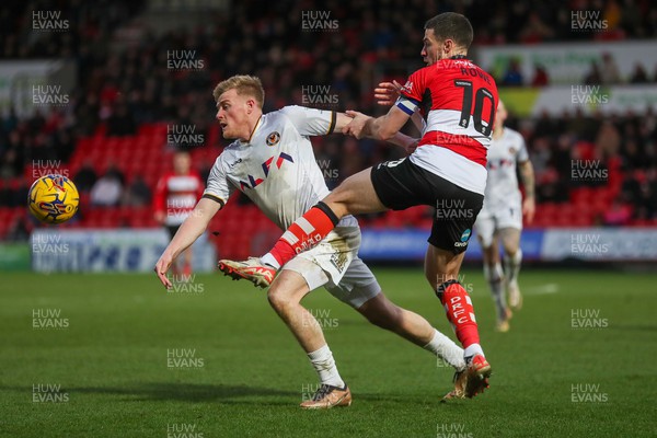 130124 - Doncaster Rovers v Newport County - Sky Bet League 2 - Will Evans of Newport lunges for the ball