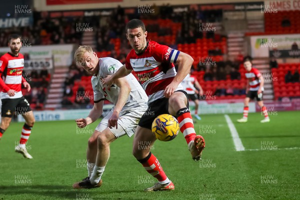 130124 - Doncaster Rovers v Newport County - Sky Bet League 2 - Will Evans of Newport fights for the ball