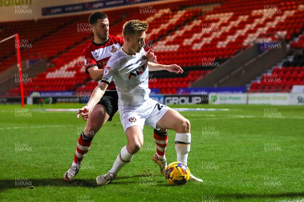 130124 - Doncaster Rovers v Newport County - Sky Bet League 2 - Harry Charsley of Newport shields the ball 