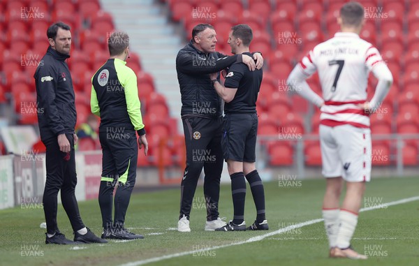 220423 - Doncaster Rovers v Newport County - Sky Bet League 2 - Manager Graham Coughlan of Newport County is spoken to by referee Simon Mather