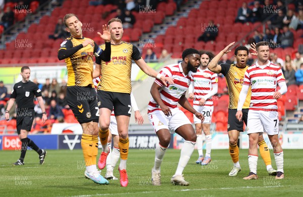220423 - Doncaster Rovers v Newport County - Sky Bet League 2 - Mickey Demetriou of Newport County heads for goal but goes wide