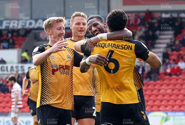 220423 - Doncaster Rovers v Newport County - Sky Bet League 2 - Priestley Farquharson of Newport County celebrates scoring an equaliser with Omar Bogle and Hayden Lindley