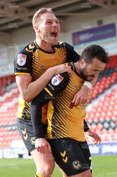 220423 - Doncaster Rovers v Newport County - Sky Bet League 2 - Aaron Wildig of Newport County celebrates scoring their 2nd goal with Cameron Norman of Newport County on top