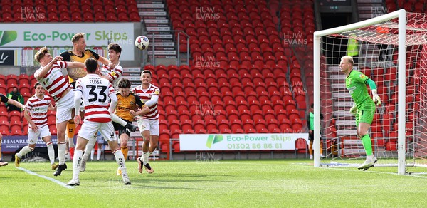 220423 - Doncaster Rovers v Newport County - Sky Bet League 2 - Cameron Norman of Newport County heads in the 3rd goal