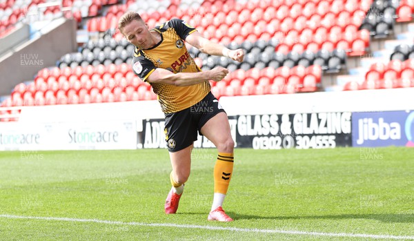 220423 - Doncaster Rovers v Newport County - Sky Bet League 2 - Cameron Norman of Newport County celebrates scoring the 3rd goal by practising his golf swing