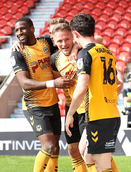 220423 - Doncaster Rovers v Newport County - Sky Bet League 2 - Cameron Norman of Newport County celebrates scoring the 3rd goal with Calum Kavanagh and Omar Bogle