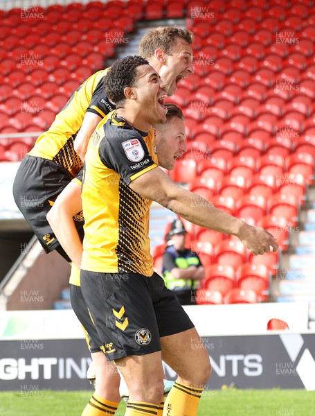 220423 - Doncaster Rovers v Newport County - Sky Bet League 2 - Cameron Norman of Newport County celebrates scoring the 3rd goal with Priestley Farquharson and Mickey Demetriou
