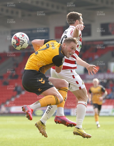 220423 - Doncaster Rovers v Newport County - Sky Bet League 2 - Cameron Norman of Newport County and Tommy Rowe of Doncaster Rovers
