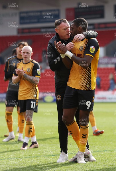 220423 - Doncaster Rovers v Newport County - Sky Bet League 2 - Manager Graham Coughlan of Newport County hugs Omar Bogle of Newport County at the end of the match