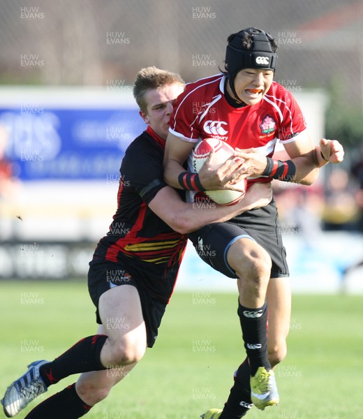 23.03.11 -  Dragons Academy v Japan High Schools -  Dragons Academy's Ethan Davies tackles Japan High School's Yoshikazu Fujita  