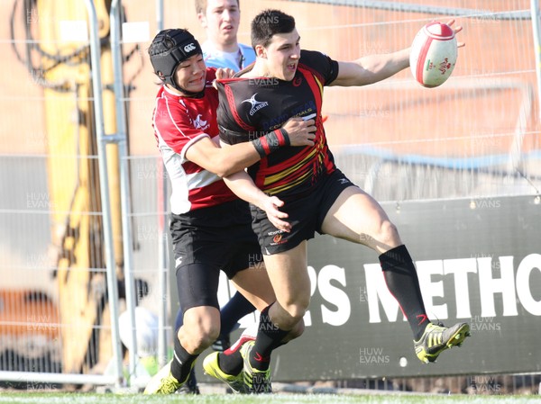 23.03.11 -  Dragons Academy v Japan High Schools -  Dragons Academy's Dom Franchi is tackled by Japan High School's Yoshikazu Fujita  