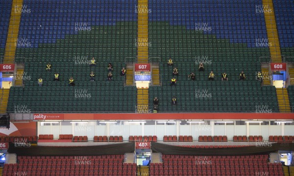 200420 -  Workers social distance themselves during the Dragon's Heart Hospital Opening at The Principality Stadium, which is ready to accept patients during the coronavirus (Covid-19) pandemic