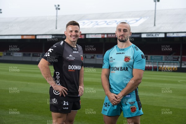 280920 -  Elliot Dee and Ollie Griffiths wearing the Dragons 2020/2021 home and away jerseys