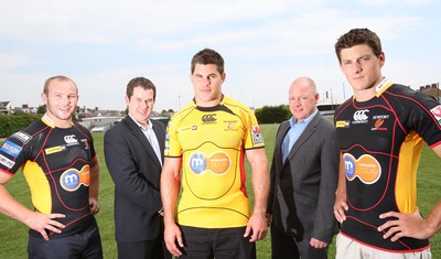 23.07.08 - Newport Gwent Dragons Kit and player announcement. Dragons new signings, (left to right), Tom Willis, Grant Webb and James Arlidge sporting the new Dragons kit for the forthcoming season, with Dragons Chief Executive Gethin Jenkins and Russell Louth, General Manager of Motorpoint Newport 