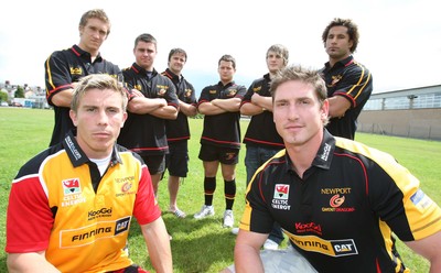 17.07.07.. Newport Gwent Dragons, new signings Dragons Richard Mustoe (lt) and Adam Jones sport the new Newport Gwent Dragons shirt for the new season, with the other new signings (left to right) Wayne Evans, Gareth McCarthy, Andy Williams, Rhodri Davies, Hugh Gustafson and Richard Parks 