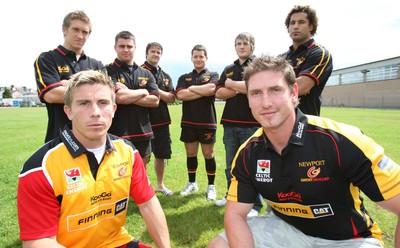 17.07.07.. Newport Gwent Dragons, new signings Dragons Richard Mustoe (lt) and Adam Jones sport the new Newport Gwent Dragons shirt for the new season, with the other new signings (left to right) Wayne Evans, Gareth McCarthy, Andy Williams, Rhodri Davies, Hugh Gustafson and Richard Parks 