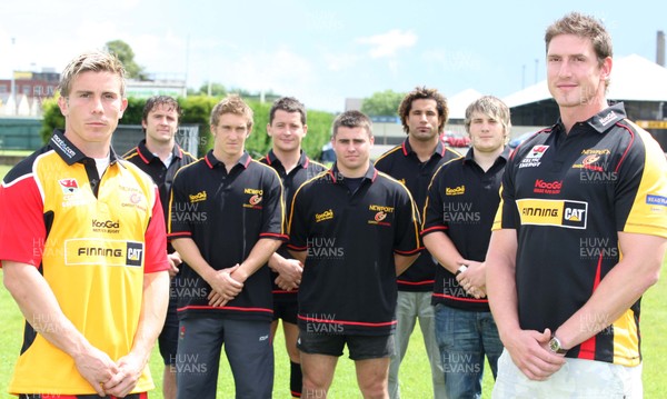 17.07.07.. Newport Gwent Dragons, new signings Dragons Richard Mustoe (lt) and Adam Jones sport the new Newport Gwent Dragons shirt for the new season, with the other new signings (left to right) Andy Williams, Wayne Evans, Rhodri Davies, Gareth McCarthy, Richard Parks and Hugh Gustafson 