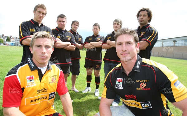 17.07.07.. Newport Gwent Dragons, new signings Dragons Richard Mustoe (lt) and Adam Jones sport the new Newport Gwent Dragons shirt for the new season, with the other new signings (left to right) Wayne Evans, Gareth McCarthy, Andy Williams, Rhodri Davies, Hugh Gustafson and Richard Parks 