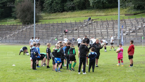 270821 - Dragons Open Training Session at Abertillery BG RFC - Young Dragons supporters go through a skills session as the Dragons take part in a training session in front of supporters at Abertillery Park