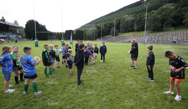 270821 - Dragons Open Training Session at Abertillery BG RFC - Young Dragons supporters go through a skills session as the Dragons take part in a training session in front of supporters at Abertillery Park