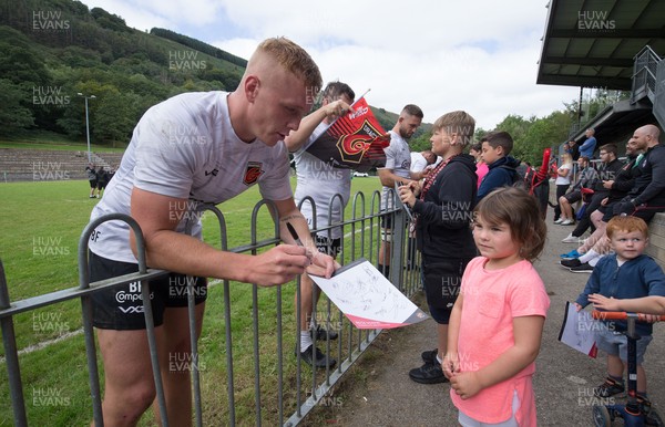 270821 - Dragons Open Training Session at Abertillery BG RFC - Ben Fry signs autographs for fans after an open training session in front of supporters at Abertillery Park
