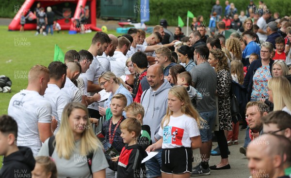 270821 - Dragons Open Training Session at Abertillery BG RFC - Dragons players sign autographs for fans after an open training session in front of supporters at Abertillery Park