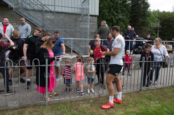 270821 - Dragons Open Training Session at Abertillery BG RFC - Jamie Roberts signs autographs for fans after an open training session in front of supporters at Abertillery Park