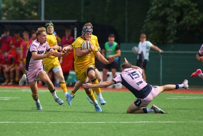160826 - Dragons RFC U18 v Cardiff Rugby U18 - WRU Regional Age Grade Championship - Gethin Tudball of Dragons is tackled by Theo Poole of Cardiff 