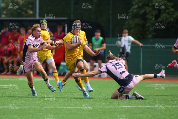 160826 - Dragons RFC U18 v Cardiff Rugby U18 - WRU Regional Age Grade Championship - Gethin Tudball of Dragons is tackled by Theo Poole of Cardiff 