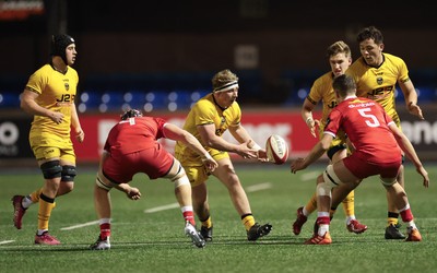 120226 - Dragons RFC U18 v Scarlets U18, WRU Regional Age Grade Championship 3rd and 4th place play off - Ciaran Beavis of Dragons takes on Rhys Owen of Scarlets and Hefin Hughes of Scarlets