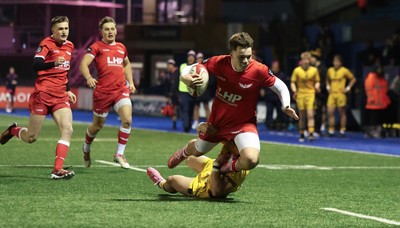 120226 - Dragons RFC U18 v Scarlets U18, WRU Regional Age Grade Championship 3rd and 4th place play off - Cole Inker of Scarlets is tackled short of the line by Brogan Leary of Dragons