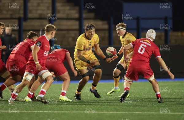 120226 - Dragons RFC U18 v Scarlets U18, WRU Regional Age Grade Championship 3rd and 4th place play off - Elliot Beavan of Dragons offloads as Cole Lacey of Scarlets and Austin Sandford of Scarlets close in