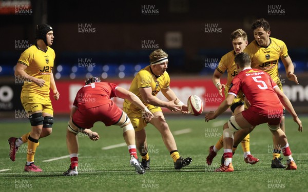 120226 - Dragons RFC U18 v Scarlets U18, WRU Regional Age Grade Championship 3rd and 4th place play off - Ciaran Beavis of Dragons takes on Rhys Owen of Scarlets and Hefin Hughes of Scarlets