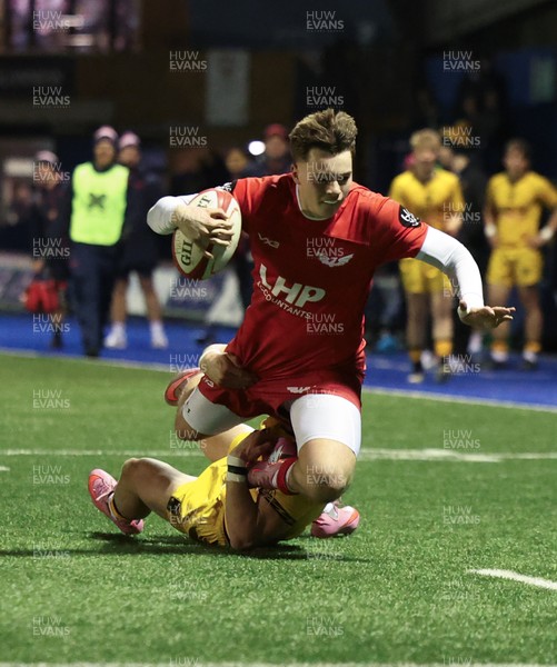 120226 - Dragons RFC U18 v Scarlets U18, WRU Regional Age Grade Championship 3rd and 4th place play off - Cole Inker of Scarlets is tackled short of the line by Brogan Leary of Dragons