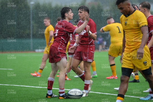 140925 - Dragons RFC U18 v Scarlets U18 - Rhys Jones of Scalets celebrates scoring a try with team mates