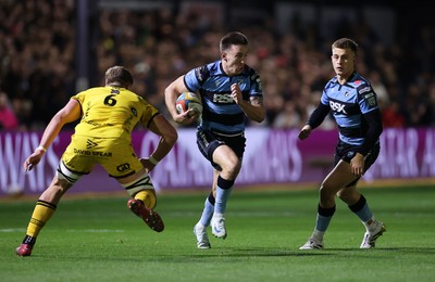 171025 - Dragons RFC v Cardiff Rugby - United Rugby Championship - Josh Adams of Cardiff is challenged by Shane Lewis-Hughes of Dragons 