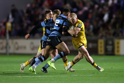 171025 - Dragons RFC v Cardiff Rugby - United Rugby Championship - Tinus de Beer of Dragons is tackled by Ben Thomas of Cardiff 